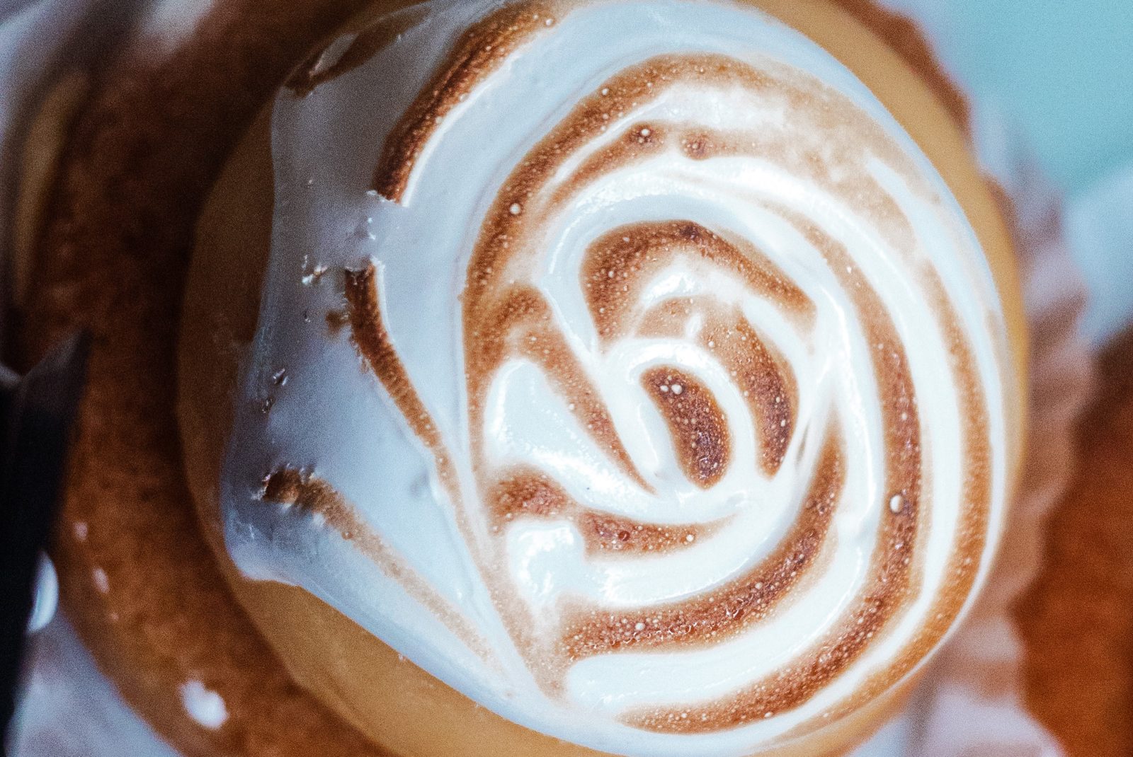 A cappuccino poured with latte art at the La Sucriere coffee counter
