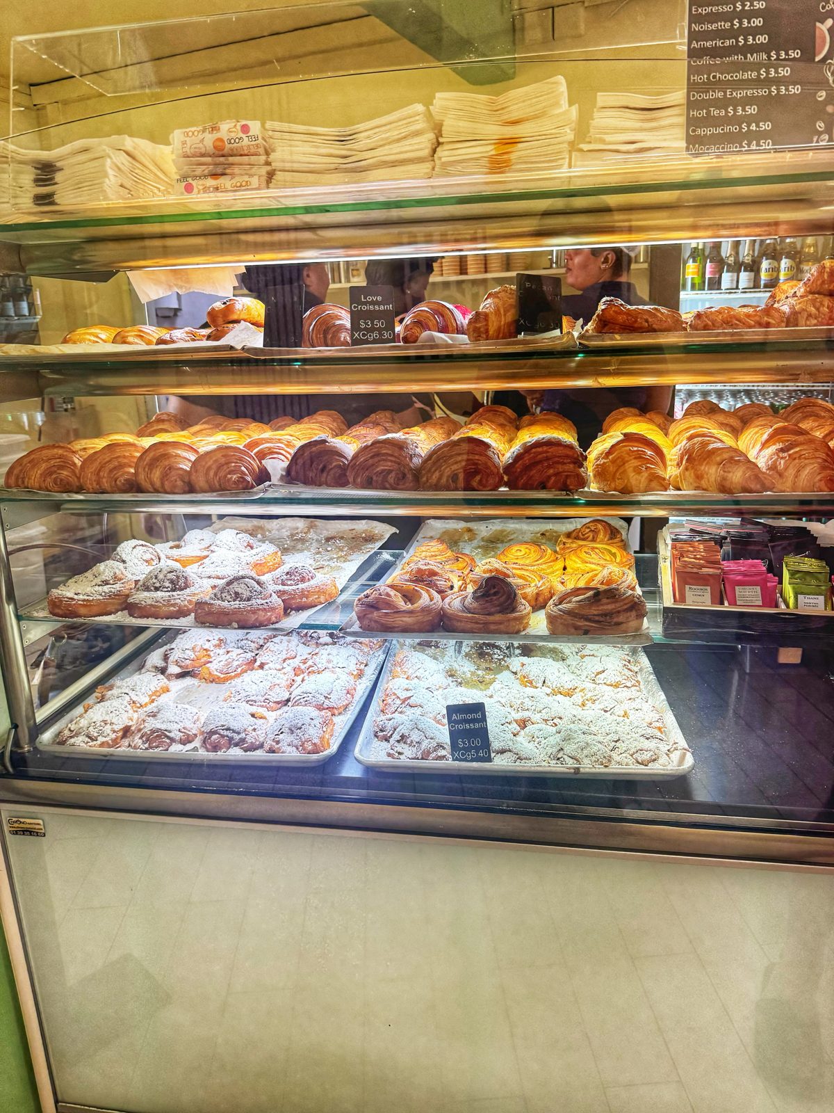 The pastry case at La Sucrière filled with croissants, viennoiserie and tarts